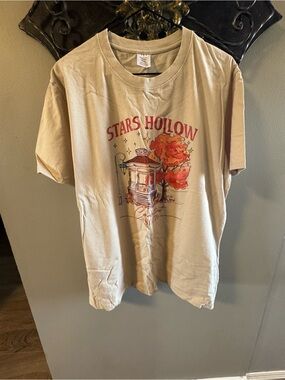 All T-shirts 3 for $30!! 🎉 
Stars Hollow Graphic Tee in Beige with Red Print